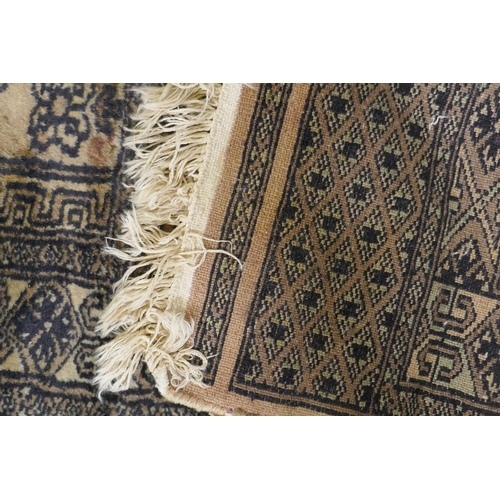 1205 - A hand woven wool Middle Eastern prayer rug, signed, 60 x 90cm, and another smaller