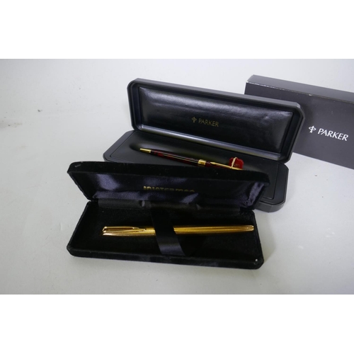 329 - A Watermans gold plated fountain pen with 18ct nib in box, appears unused, and a Parker Sonnet lacqu... 