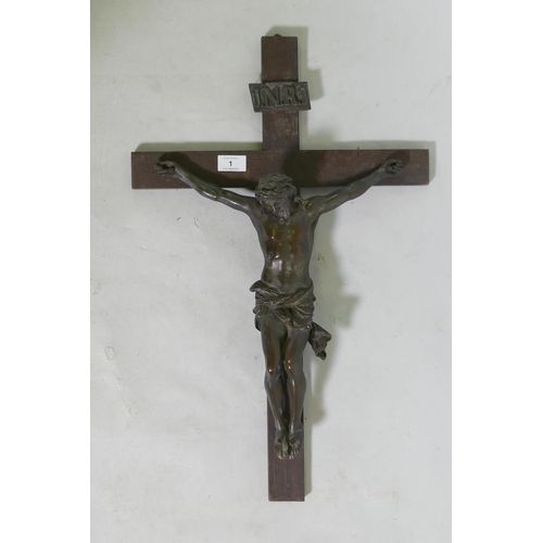 1 - A C19th Continental bronze Corpus Christi, mounted on an oak crucifix with tablet, marked AA, French... 