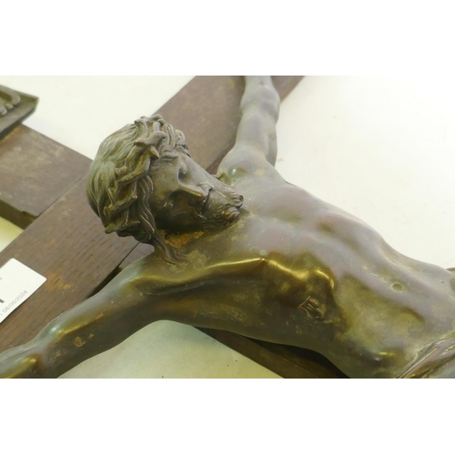 1 - A C19th Continental bronze Corpus Christi, mounted on an oak crucifix with tablet, marked AA, French... 