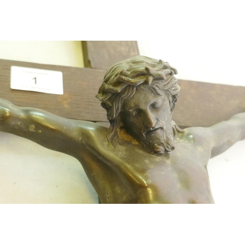 1 - A C19th Continental bronze Corpus Christi, mounted on an oak crucifix with tablet, marked AA, French... 