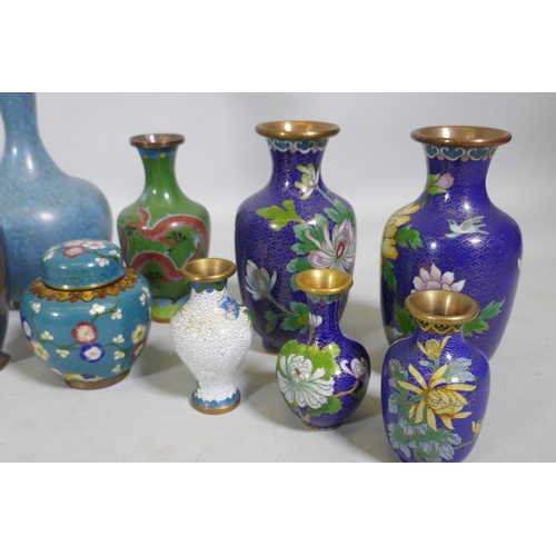 10 - A collection of Chinese cloisonne vases with dragon and floral decoration, largest 31cm high