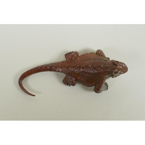 100 - A Japanese style bronze okimono horned lizard, 7cm long