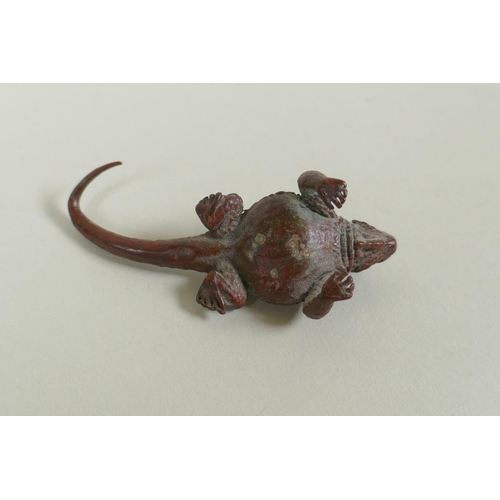 100 - A Japanese style bronze okimono horned lizard, 7cm long