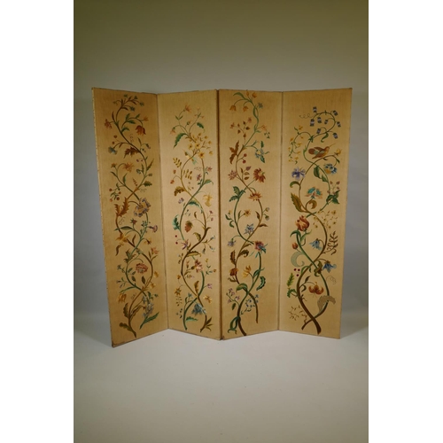 1002 - An antique Arts & Crafts style four fold screen, with embroidered crewel work designs of flowers... 