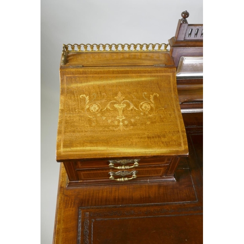 1006 - A Victorian inlaid mahogany inverted breakfront bonheure de jour, with pierced brass gallery top and... 