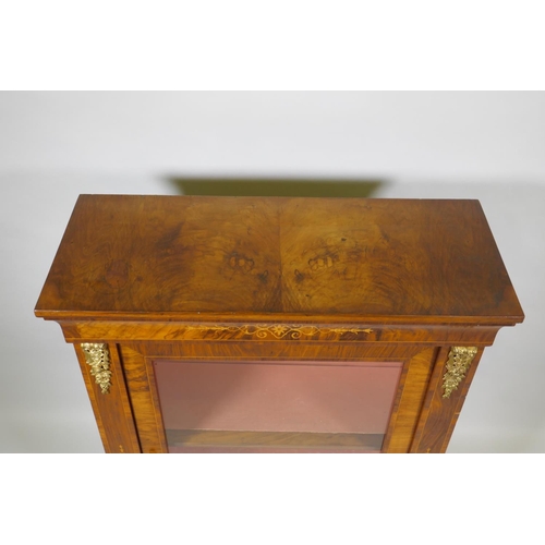 1011 - A Victorian inlaid figured walnut pier cabinet with ormolu mounts and single glazed door, 78 x 32 x ... 