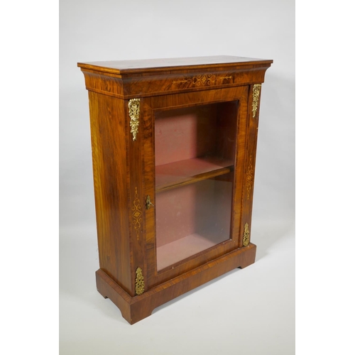 1011 - A Victorian inlaid figured walnut pier cabinet with ormolu mounts and single glazed door, 78 x 32 x ... 