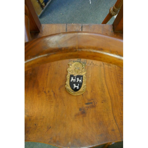 1016 - An early C19th Irish walnut elbow chair with bergere caned back, shepherd's crook arms and saddle se... 