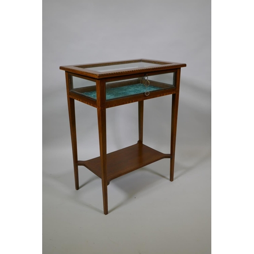 1018 - An antique inlaid mahogany vitrine on square tapering supports united by an under tier, 56 x 36cm, 7... 