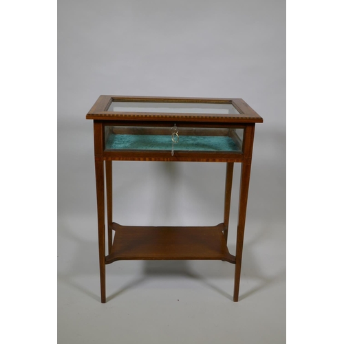 1018 - An antique inlaid mahogany vitrine on square tapering supports united by an under tier, 56 x 36cm, 7... 