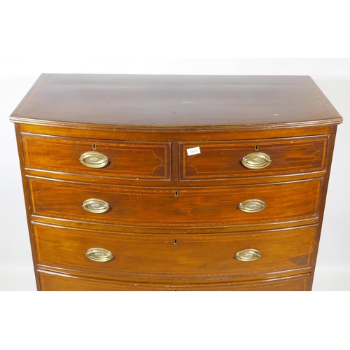 1023 - A George III inlaid mahogany bowfront chest of two plus three drawers, with brass plate handles, rai... 