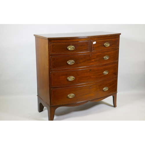 1023 - A George III inlaid mahogany bowfront chest of two plus three drawers, with brass plate handles, rai... 