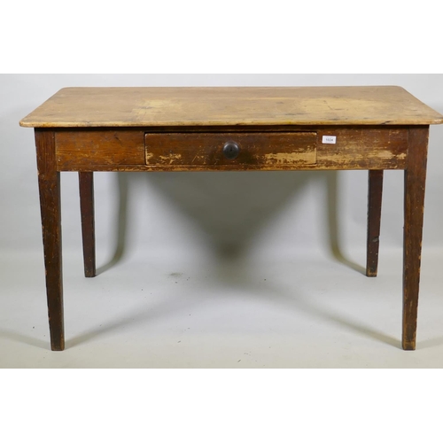 1024 - An early C19th pine sculley table with single drawer and scrubbed top, raised on tapering supports, ... 