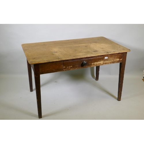 1024 - An early C19th pine sculley table with single drawer and scrubbed top, raised on tapering supports, ... 