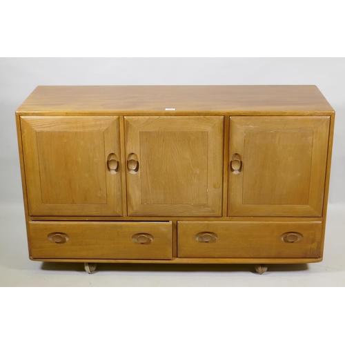 1025 - An Ercol blond elm Windsor sideboard, Model 468, 129 x 44cm, 76cm high