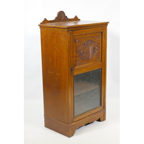 1026 - A Victorian walnut music cabinet with carved back and door, 50 x 34 x 99cm