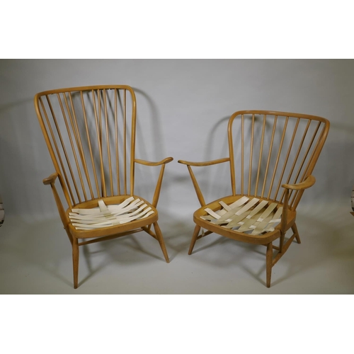 1034 - An Ercol beech and elm Windsor tall back armchair Model 478, and a similar Ercol model 334 armchair