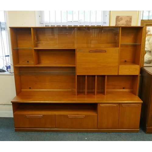 1037 - A mid century teak two section cabinet by Meredew, with sliding glass doors, open shelves and fall f... 