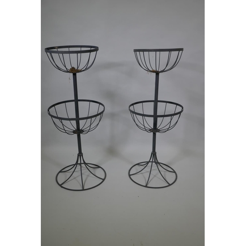 1047 - A pair of metal two tier garden basket planter holders, 88cm high