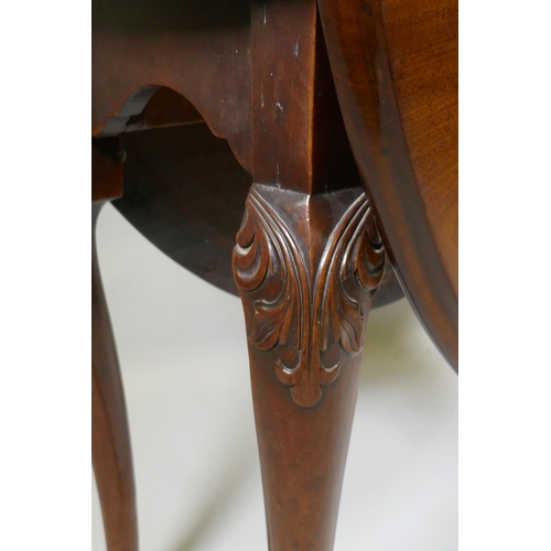 1049 - A Georgian mahogany drop leaf table, with oval top and shaped end frieze, raised on cabriole support... 