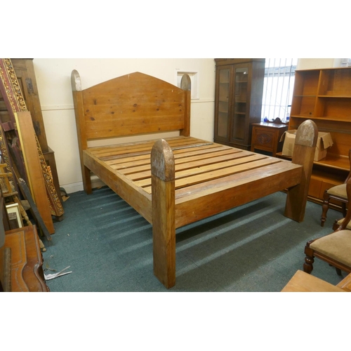 1051 - An oversize pine bed, the head boards capped with metal mounts, by repute formerly the property of P... 