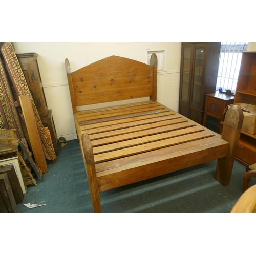 1051 - An oversize pine bed, the head boards capped with metal mounts, by repute formerly the property of P... 