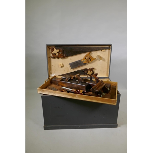 1055 - A vintage painted tool chest containing a collection of carpenter's tools, 78 x 43cm, 47cm high