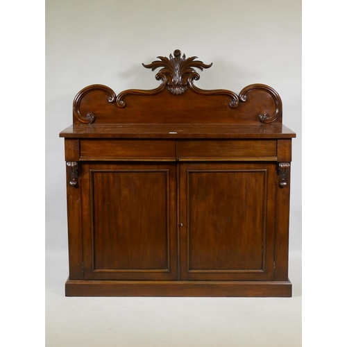 1058 - A Victorian mahogany chiffonier, the back with carved crest, the base with two frieze drawers over t... 