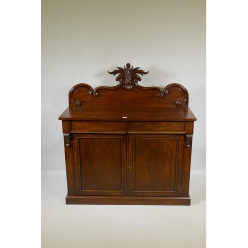 1058 - A Victorian mahogany chiffonier, the back with carved crest, the base with two frieze drawers over t... 