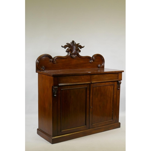 1058 - A Victorian mahogany chiffonier, the back with carved crest, the base with two frieze drawers over t... 