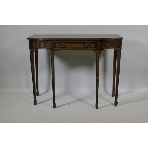 1060 - An Adam style mahogany breakfront side table with single drawer and carved fluted frieze, raised on ... 