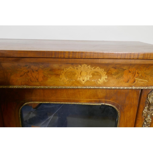 1065 - A Victorian marquetry inlaid breakfront walnut credenza with moulded frieze top over three arched gl... 