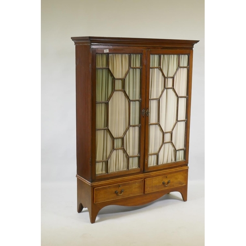 1066 - A Victorian mahogany bookcase with two astragal glazed doors over two drawers, raised on shaped supp... 