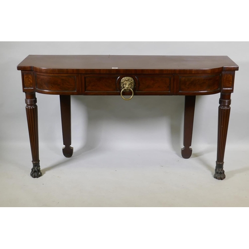 1067 - A Georgian mahogany breakfront serving table with panelled frieze and single drawer, raised on reede... 