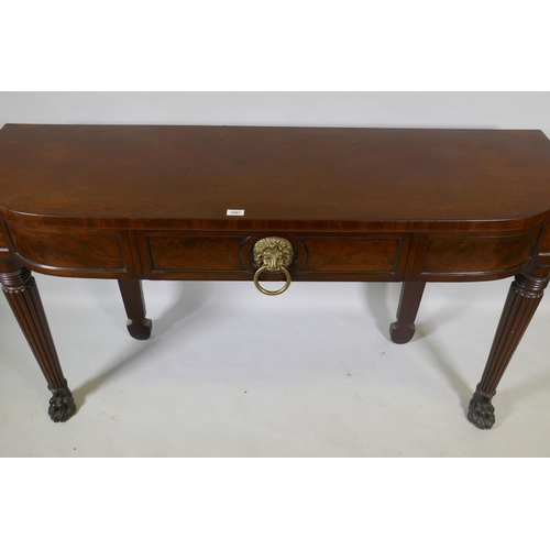 1067 - A Georgian mahogany breakfront serving table with panelled frieze and single drawer, raised on reede... 