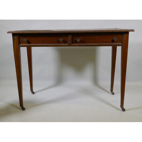 1077 - A C19th mahogany writing table, with inset faux leather top, carved bead edge over two drawers, rais... 