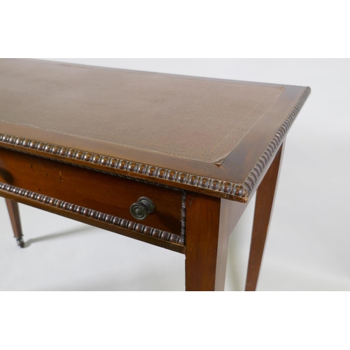 1077 - A C19th mahogany writing table, with inset faux leather top, carved bead edge over two drawers, rais... 