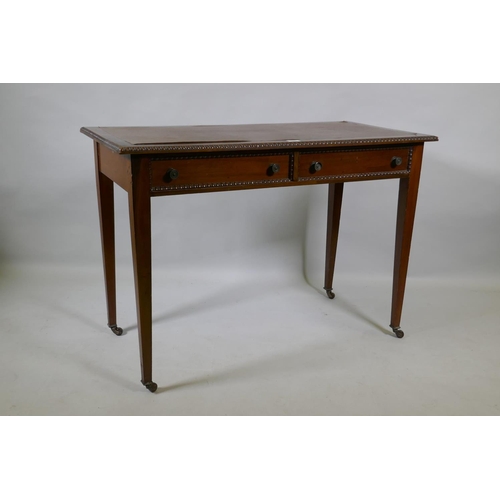 1077 - A C19th mahogany writing table, with inset faux leather top, carved bead edge over two drawers, rais... 