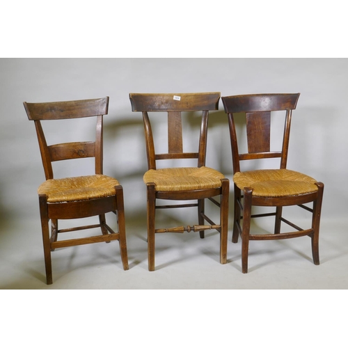 1078 - A harlequin set of three antique provincial rush seated dining chairs