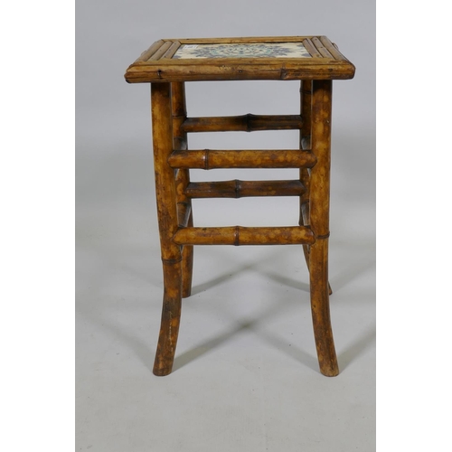 1081 - An antique Oriental bamboo occasional table inset with an Iznik tile top, 30 x 30cm, 47cm high