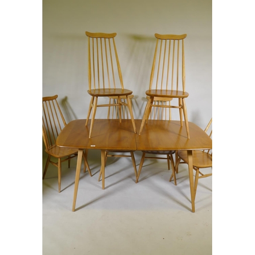 An Ercol Grand Windsor blond elm and beech extending dining table Model 444, and six matching Ercol dining chairs, Model 369, 224 x 90cm, 71cm high