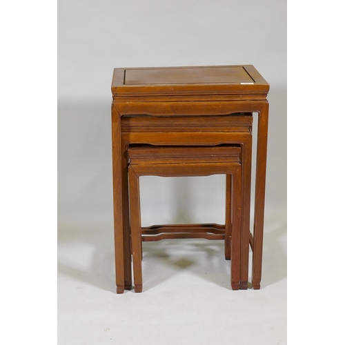 1092 - A nest of three Chinese hardwood occasional tables, 48 x 36 x 69cm