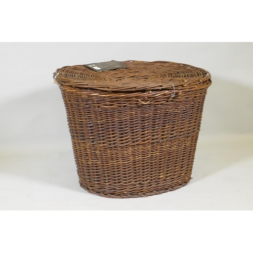 1093 - An antique wicker laundry basket, 77 x 60 x 55cm