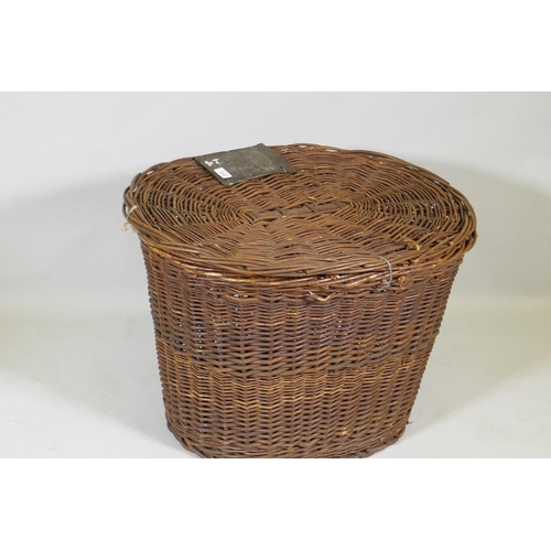 1093 - An antique wicker laundry basket, 77 x 60 x 55cm