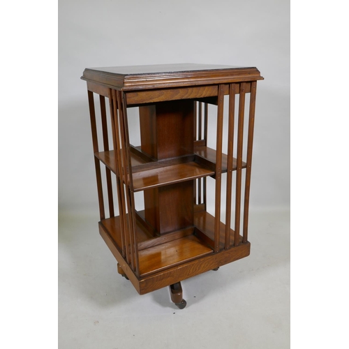 1100 - An Edwardian mahogany revolving bookcase, 50 x 50 x 89cm