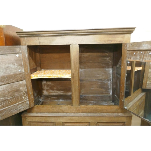 1104 - An C18th oak livery cupboard, 140 x 54cm, 177cm high