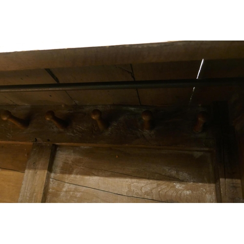 1104 - An C18th oak livery cupboard, 140 x 54cm, 177cm high