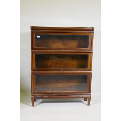 1110 - A mahogany Globe Wernicke style three section bookcase, raised on a base with shaped supports, 87 x ... 