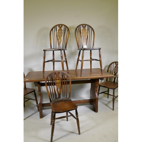 1113 - A set of five wheelback kitchen chairs and oak refectory style table, with solid top, early C20th, 6... 